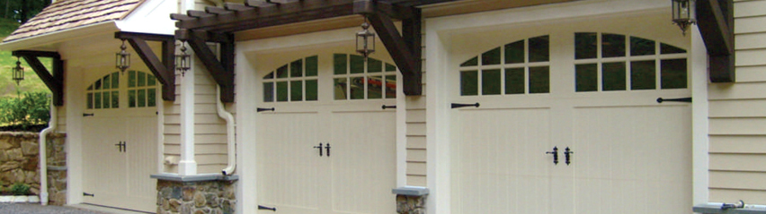 Three car garage with carriage house doors